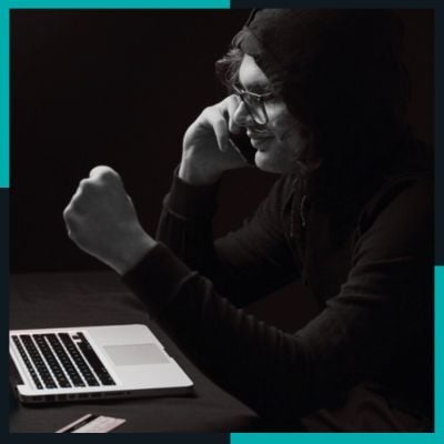 \Hacker in a hoodie celebrating after breaching an unsecured application, illustrating the risks of poor AppSec practices. \Hacker in a hoodie celebrating after breaching an unsecured application, illustrating the risks of poor AppSec practices.