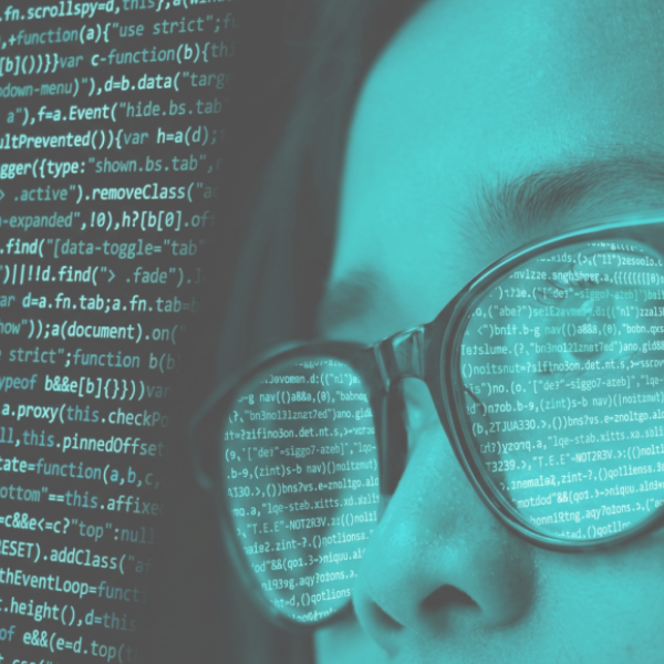 Application security analyst reviewing code reflected in eyeglasses